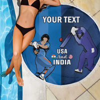 Round blue cricket beach blanket with white fringe, USA and India graphic on person