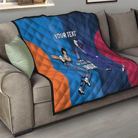Blue cricket quilt on sofa with orange and pink diagonal panels, players, and 'YOUR TEXT'
