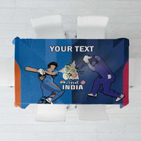 Blue cricket-themed tablecloth with player graphics and text 'And India' plus 'YOUR TEXT'.