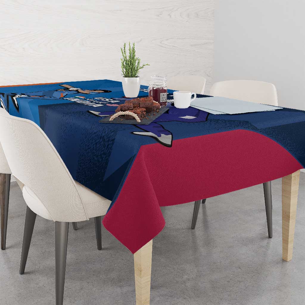 Blue and red/pink cricket tablecloth with player graphic across the tabletop.
