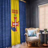 Curtains with blue fabric and yellow center panels featuring a flag-style graphic.
