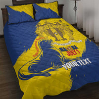 Blue and yellow quilt bed set with two matching pillowcases, personalized crest print
