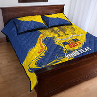 Blue and yellow quilt bed set with two pillowcases, corner crest and personalized text