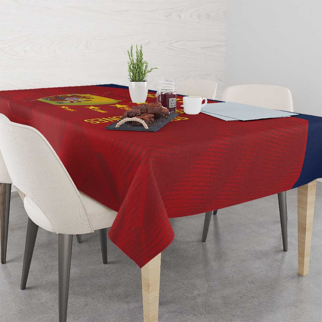 Red Spain football tablecloth on a dining table with chairs and centerpiece