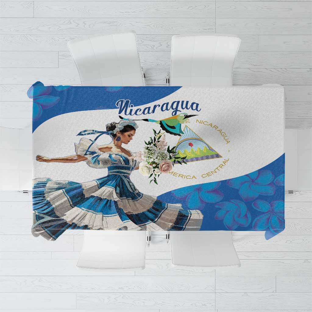 Blue Nicaragua-themed tablecloth with dancing girl graphic and floral design