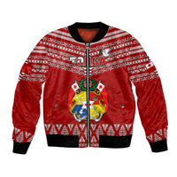 Red patterned bomber jacket with central crest and TO'IIGA graphic, front zip
