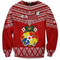 Red rugby sweatshirt with white geometric pattern and central Tongan crest