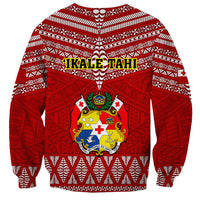 Red rugby sweatshirt with IKALE TAHI lettering and central Tongan crest