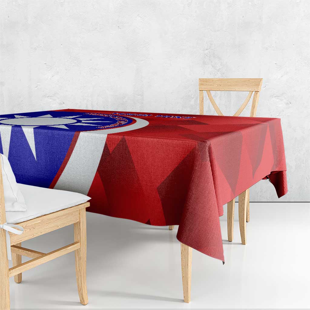 Red badminton tablecloth on dining table with blue-and-white emblem