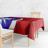 Red badminton tablecloth on dining table with blue-and-white emblem