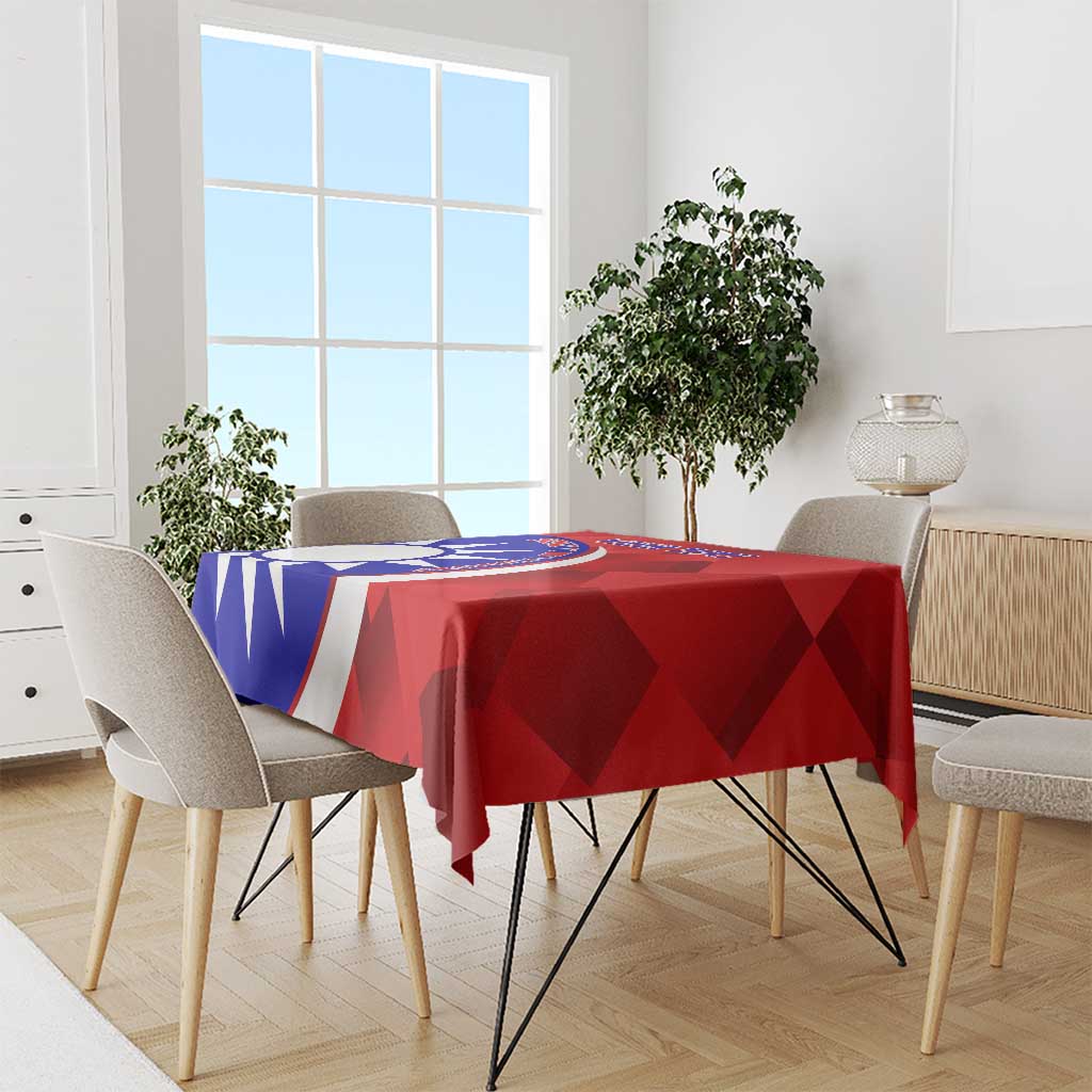 Red badminton tablecloth on dining set with blue-and-white emblem