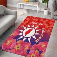 Red floral area rug with white sunburst emblem, pink flowers and 'YOUR TEXT' heading