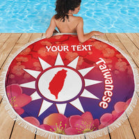 Round red beach blanket with white sun emblem, pink flowers, fringe border, 'YOUR TEXT'.