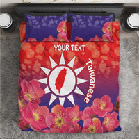 Personalized bedding set with red and purple floral duvet, white sun emblem and text panel
