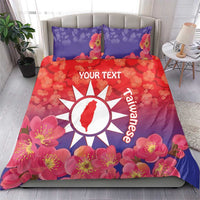 Personalized bedding set with red-purple floral duvet and pillows, white sun emblem and text