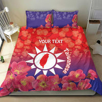 Personalized bedding set with red and purple floral duvet, white sun emblem and two pillows