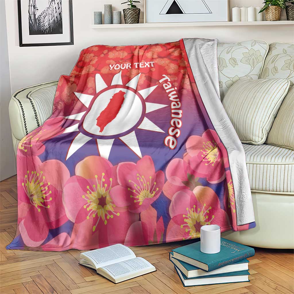 Personalised red blanket with floral blossoms, white sun emblem, 'YOUR TEXT' and text.