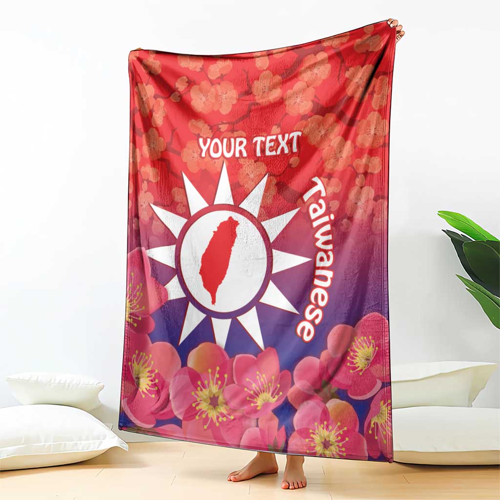 Personalised red blanket with floral blossoms, white sun emblem and 'YOUR TEXT' on front.
