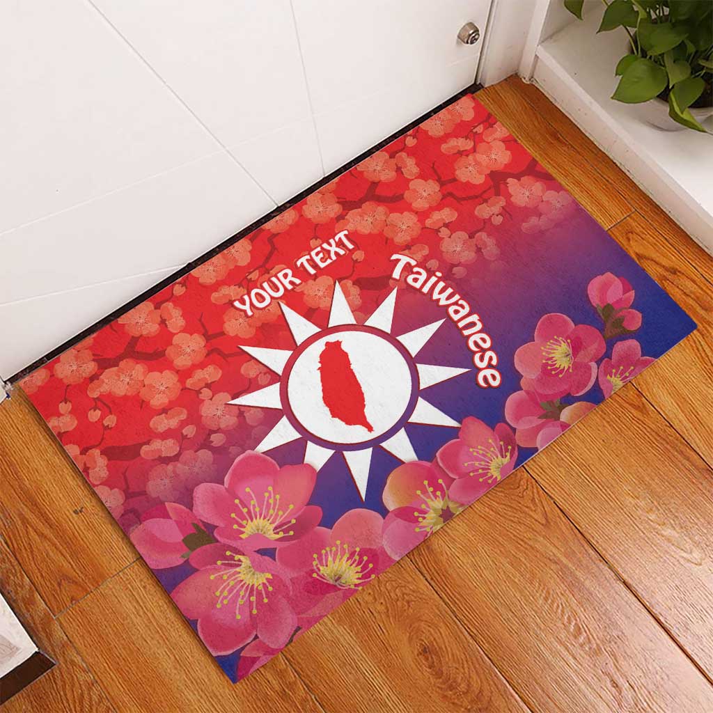 Red rubber doormat with Taiwan emblem and blossoms, custom text on wooden floor