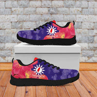 Purple and red low-top sneakers with black sole, front view on white display box