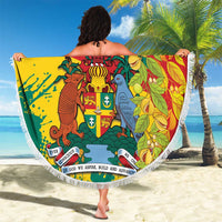 Round fringed blanket held up, Grenada crest with leaves and bird in green, yellow, red.
