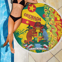 Round fringed beach blanket close-up with Grenada emblem and bird artwork in green-yellow-red.