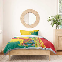 Red, green, and yellow duvet with two pillowcases on a wooden bed frame, crest artwork