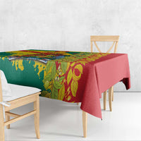 Tablecloth with green floral panel and red border, draped over a bench seat