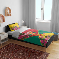 Grenada flag bedding set on dark bed frame: red center, green bottom, yellow pillows