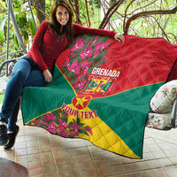 Grenada 1974 quilt held outdoors, red-green-yellow flag design with floral border