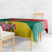 Grenada flag tablecloth over table with red trim and green-yellow diagonal paneling