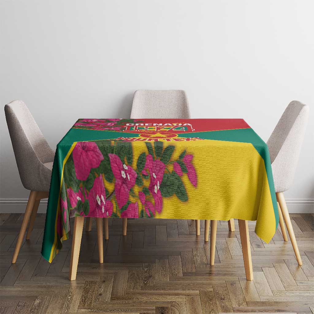 Grenada flag tablecloth on dining table with pink flowers and bold yellow-green center panel