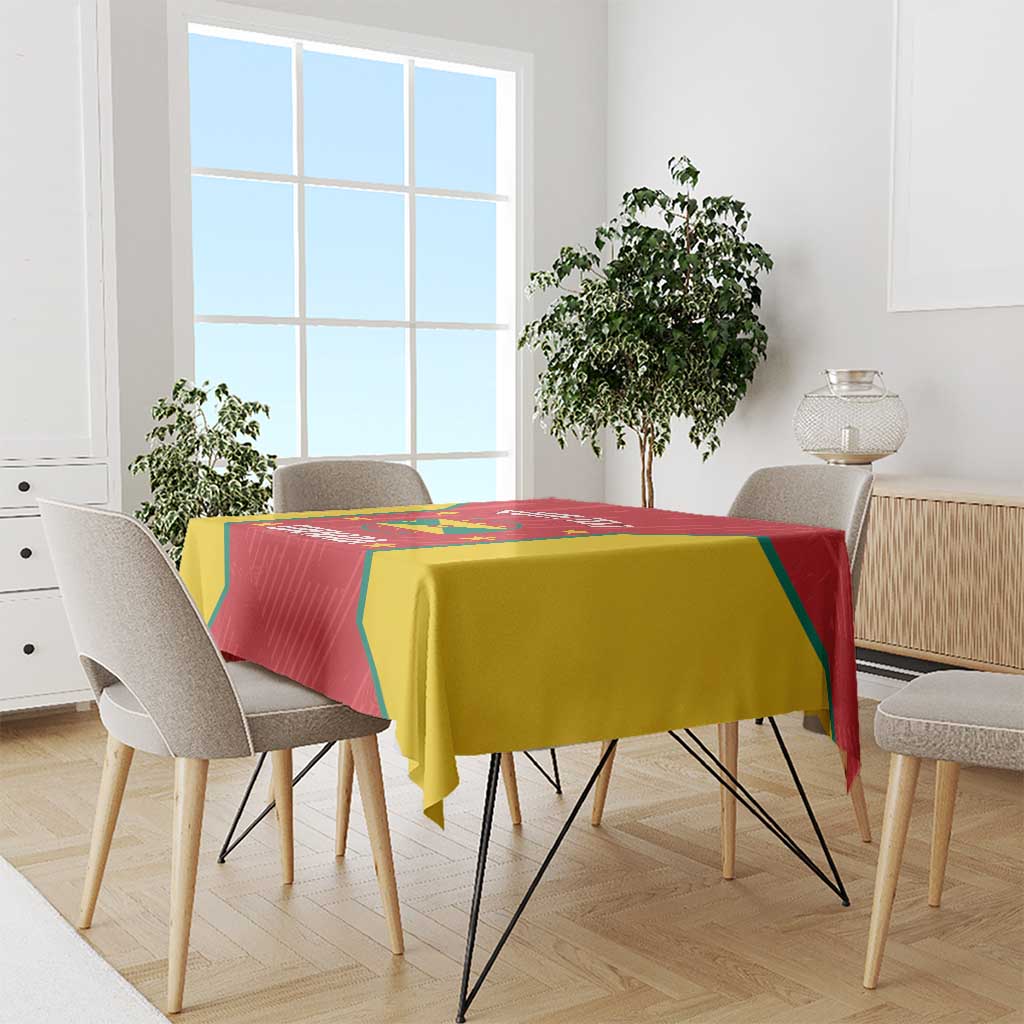 Red and yellow Grenada cricket tablecloth draped on a dining table