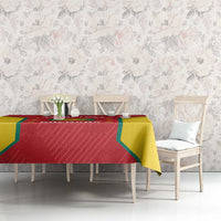 Red and yellow Grenada cricket tablecloth on dining set with chairs