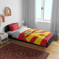Grenada flag football bedding set on bed, red/yellow duvet with 'Your Tix' and crest