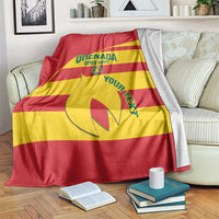 Red and yellow Grenada football blanket with printed crest and text design