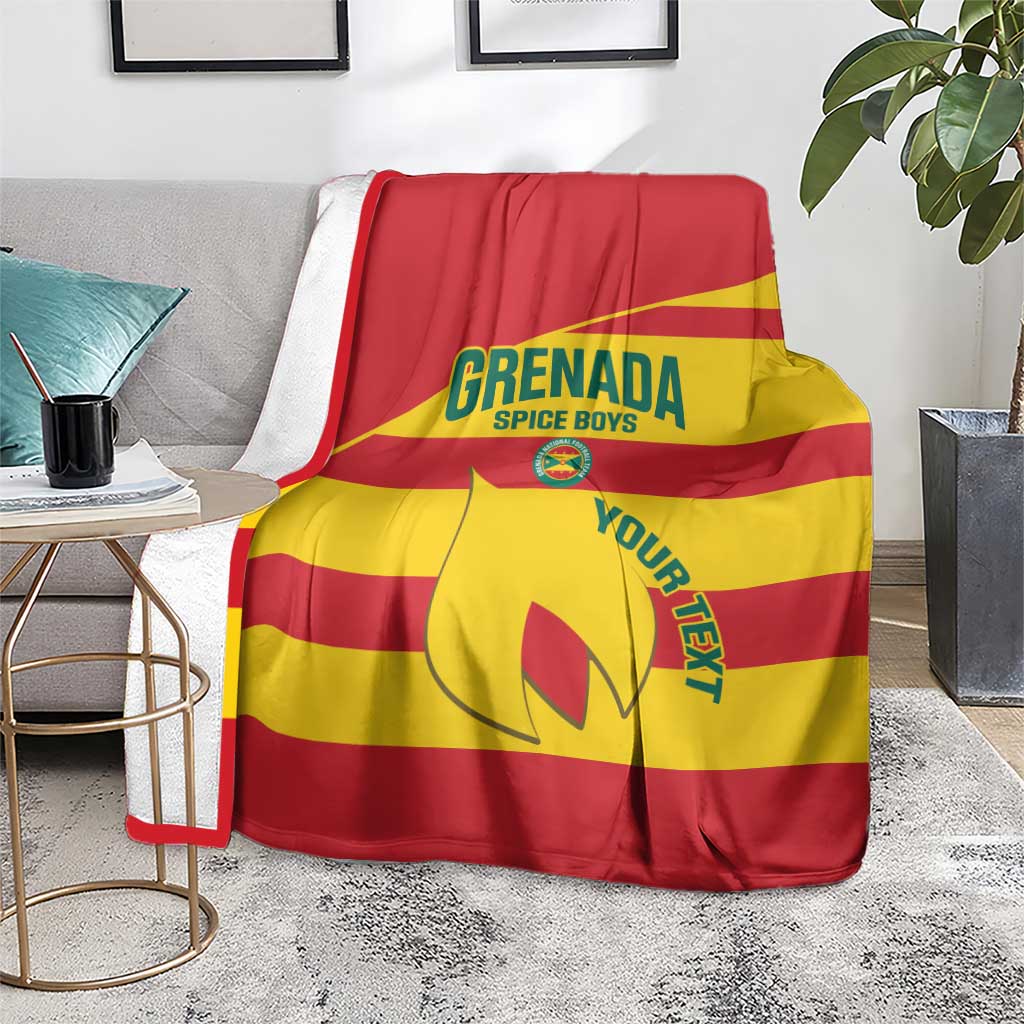 Red and yellow football blanket on floor, printed Grenada crest graphic