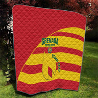 Red and yellow quilt showing Grenada Spice Boys text, crest, and football graphic