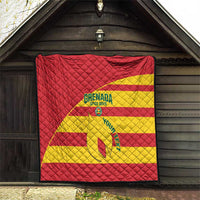 Red and yellow Grenada Spice Boys quilt with crest and football graphic, diamond-quilted surface