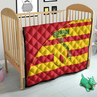 Red and yellow quilt on a crib with Grenada Spice Boys logo, diamond quilted texture