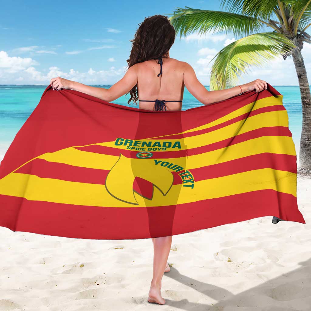 Red and yellow striped sarong with back graphic print, worn as a beach wrap