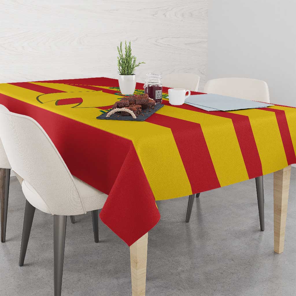 Red and yellow striped football tablecloth with hanging corner over tabletop