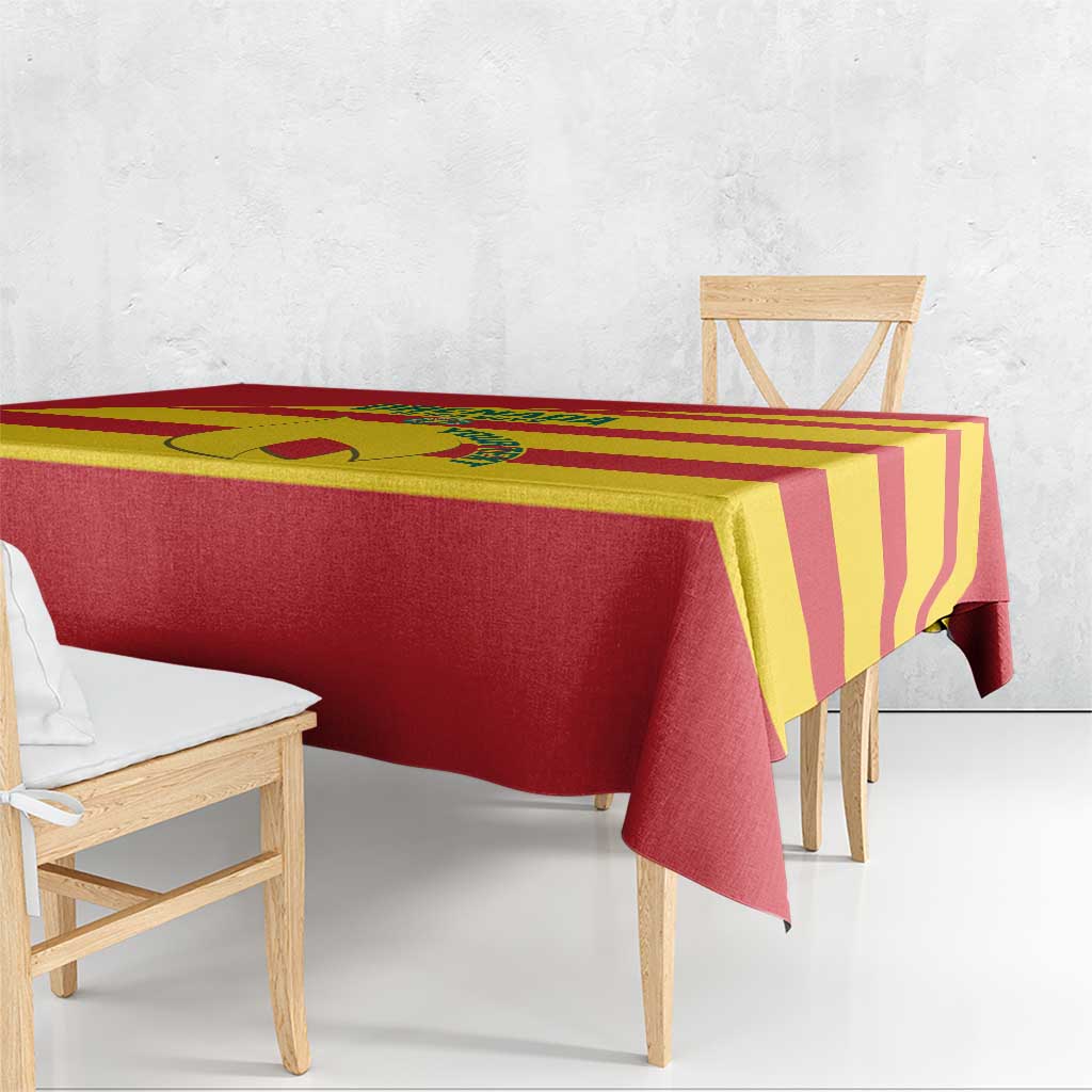 Red and yellow striped football tablecloth draped along table edge