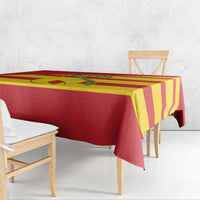 Red and yellow striped football tablecloth draped along table edge