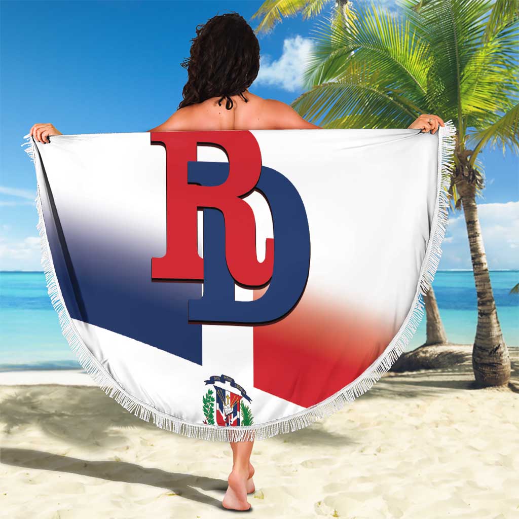 Fringed round beach blanket with white Dominican flag graphic, custom text and DB logo, held up