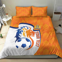 Orange and white soccer bedding set with lion and ball graphic on duvet and matching pillows