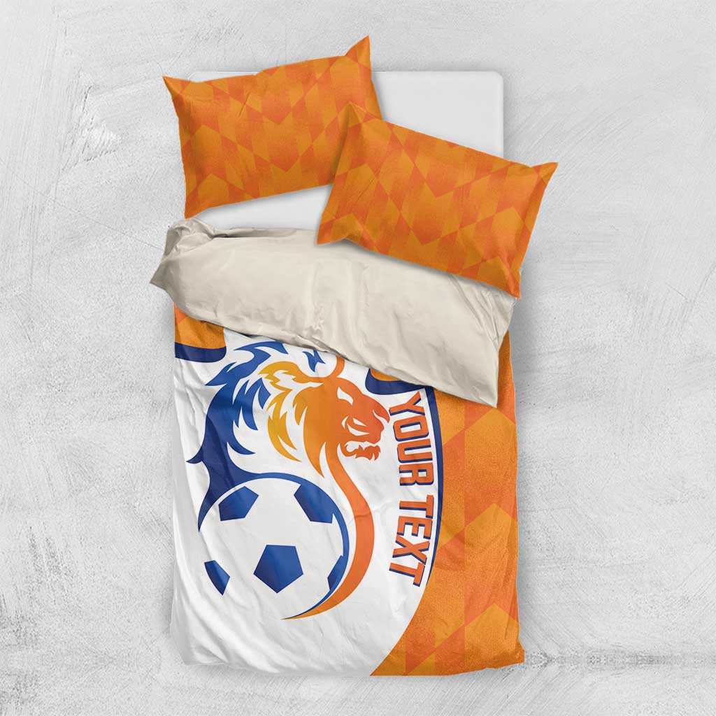 Orange and white soccer duvet set with lion logo, ball motif, and 'YOUR TEXT' text