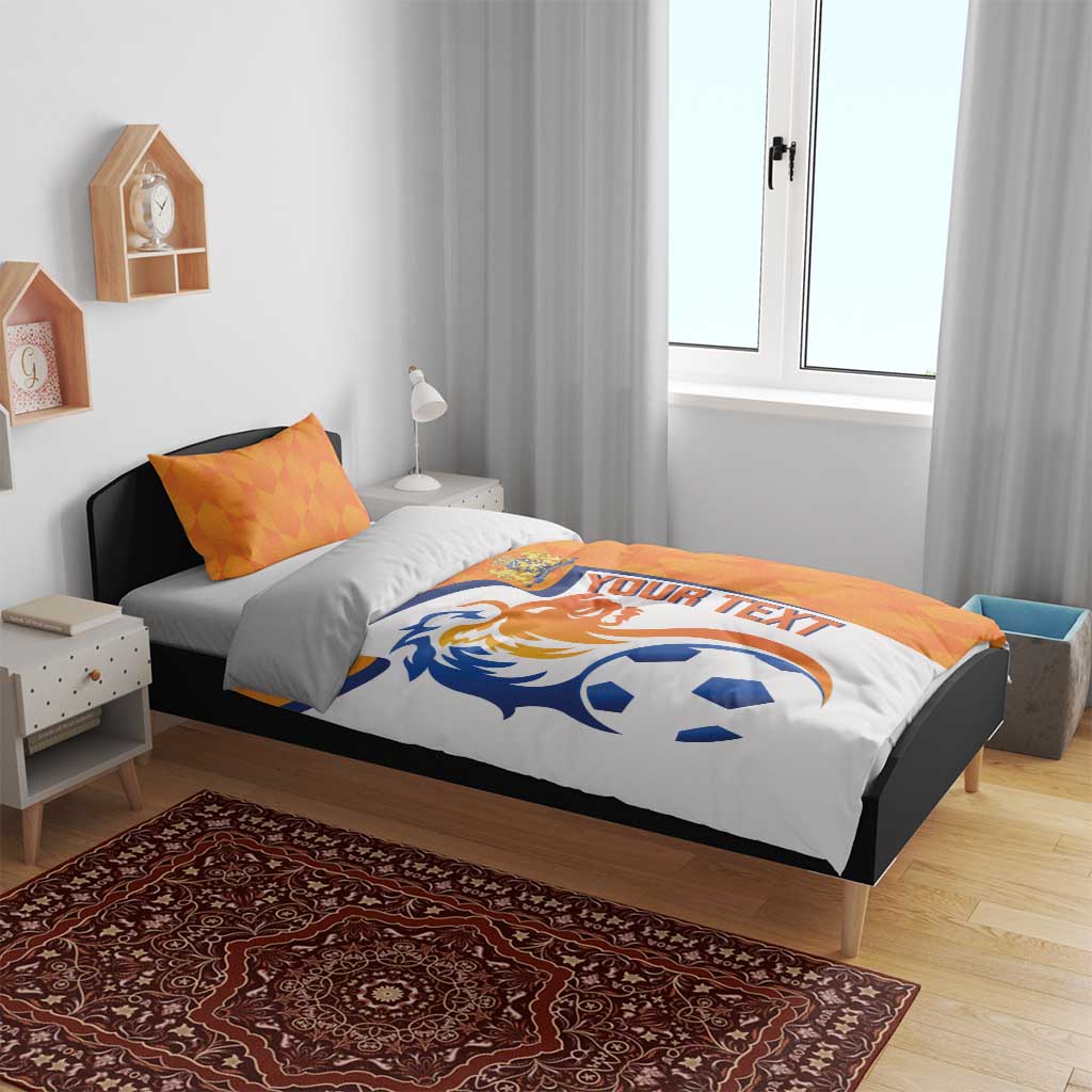 Orange and white soccer bedding set with lion and ball motif on duvet with pillow set