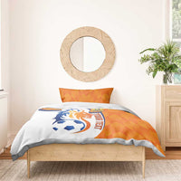 Orange and white soccer bedding set with lion logo and 'YOUR TEXT' text on duvet