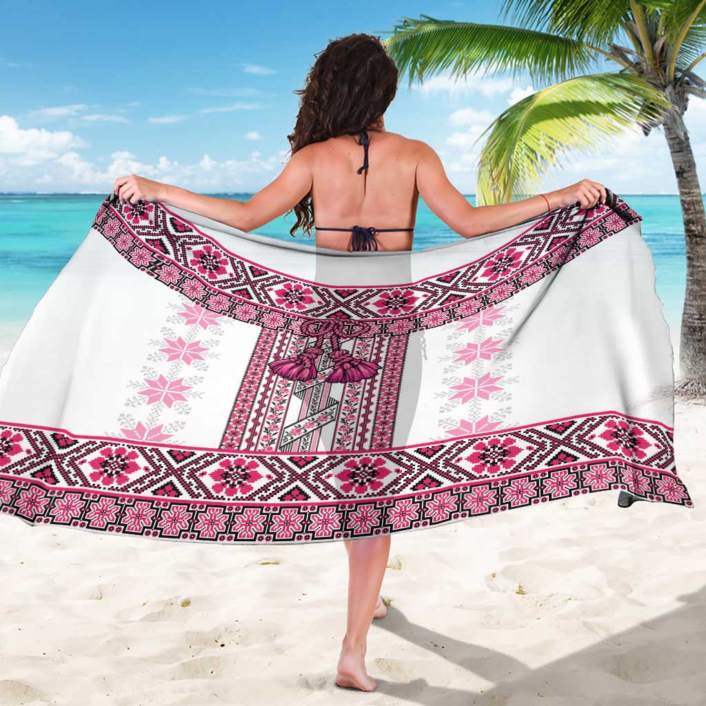 Pink folk patterned sarong with magenta border, worn as a wrap skirt by bare back
